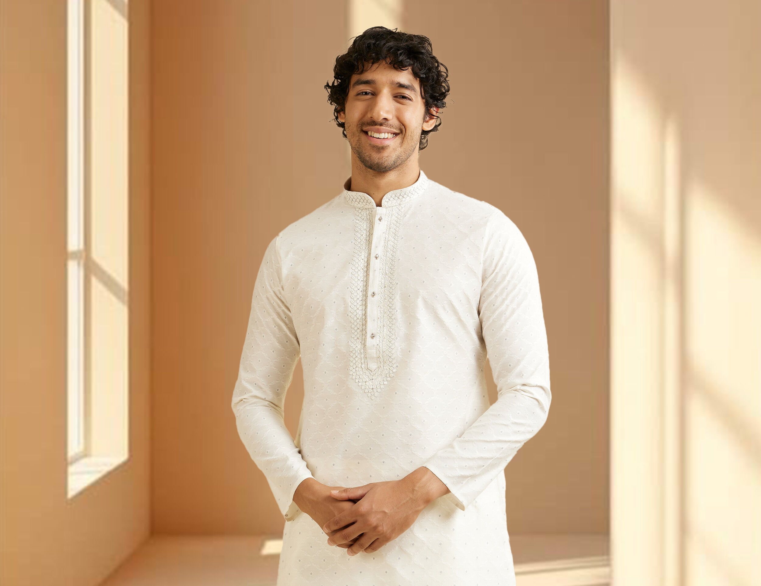 Men flaunting his modern white kurta